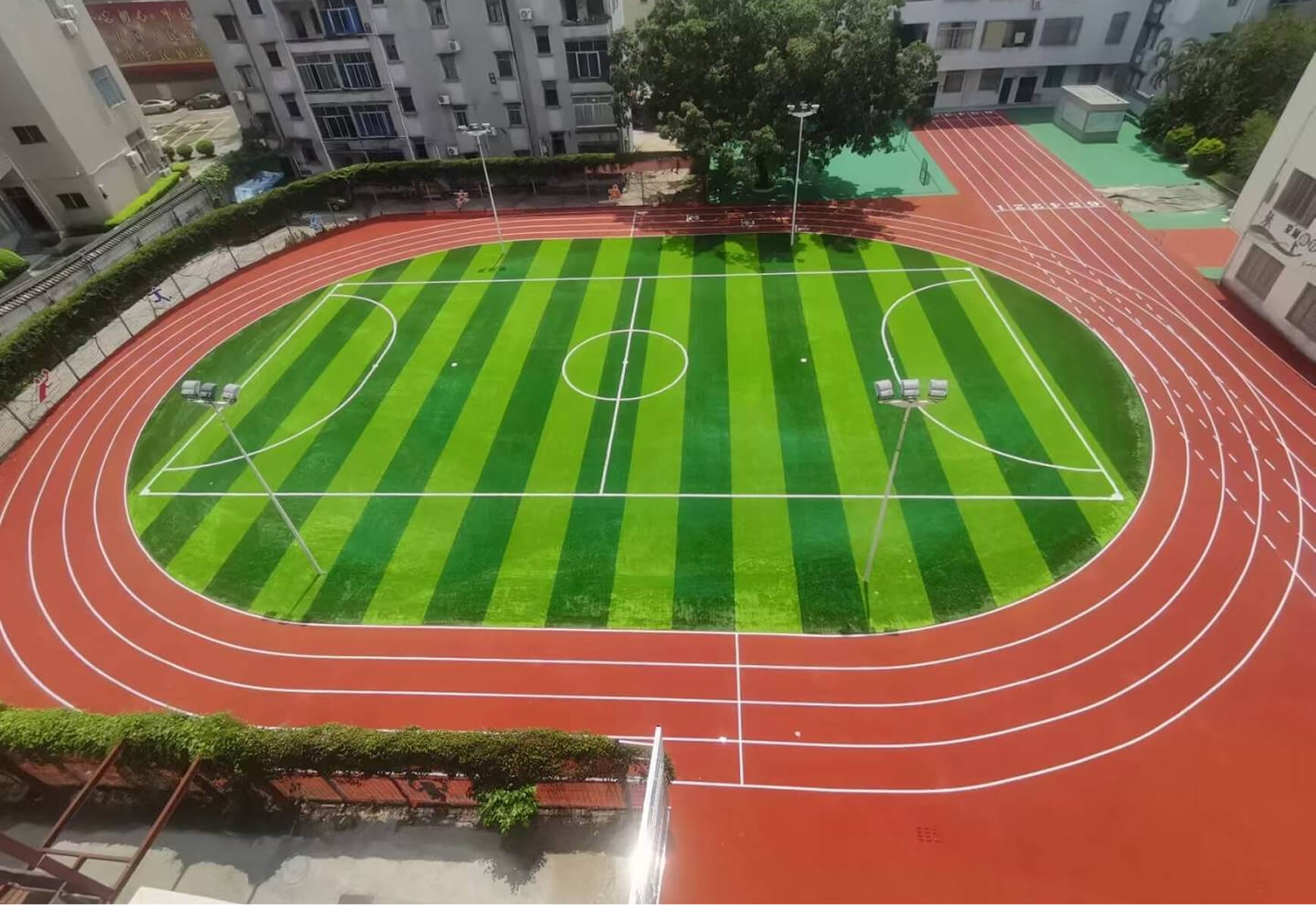 All-weather synthetic rubber athletic track construction